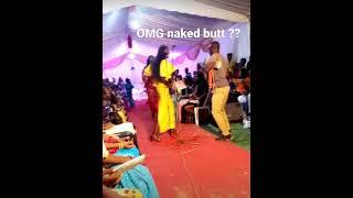 woman nearly naked on stage as her wardrobe malfunctions