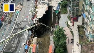 Road collapses after water pipes burst near construction site in China