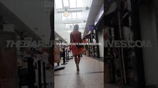 Barefoot shopping - Blonde girl barefoot on city streets