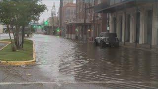 A closer look at rough surf, flooding along the Strand on Galveston Island