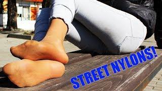 I take off my boots on the street and show my legs in socks and pantyhoses