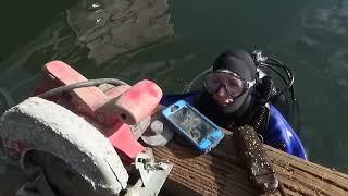 Female Diver is Diving with Neoprene Drysuit in Sea