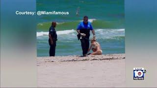 Video shows Bal Harbour police officer discover brick of cocaine that washed up on Haulover Beach