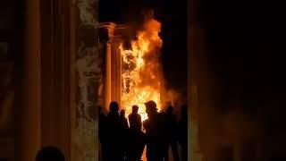 Protesters against Macron torch the entrance to the Bordeaux city hall