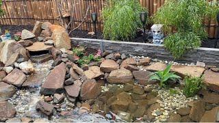 Backyard pond completed  Small waterfalls and goldfish swimming   It's amazing