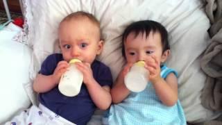 Twin babies drinking milk after nap