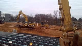 Cat 330 building underground retention pond