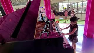 playing a Grand Piano in Sm Marikina