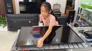 Girl repairs Sony TV, power indicator light flashes.