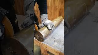 Cutting up a giant bullet shell From russian tank