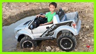 Kruz Joyriding His Power Wheel Ride On Ford Raptor STUCK In The Mud Towing Using His Dada's Rollback