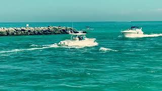 Boats traveling Baker’s Haulover Inlet Bal Harbour Florida