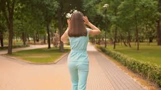 Girl walking alone I Copyright free stock clip I Back view I Green background