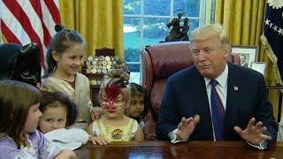 Trump gives treats to costumed kids in Oval Office for Halloween