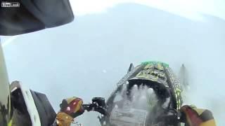 LiveLeak com   100 Foot Snowmobile Cliff Jump