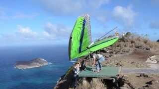 Dave Goto launches his hang glider at Makapuu, Oahu