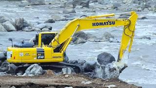 Excavator Down To The River Working For The Dam Reinforcement Construction