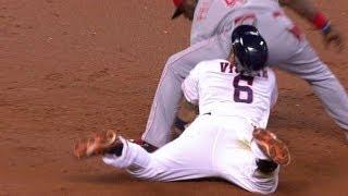 Villar slides into Phillips' backside