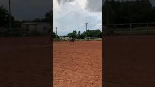 Paisley and ChicaLinda practice their horsemanship pattern in the rain