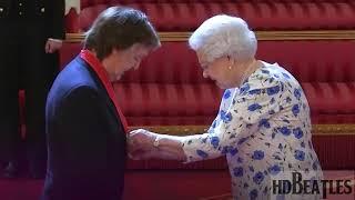 Sir Paul McCartney given the award for services to music from the Queen [Buckingham Palace, London]