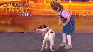 The girl plays with trained dog. Ukraine's Got Talent KIDS