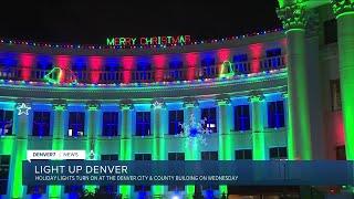 Holiday lights turn on at the Denver City and County Building Wednesday