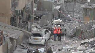 Buildings and vehicles damaged in aftermath of Iranian strike in Bnei Brak, Israel