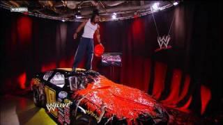 Kofi Kingston defaces Randy Ortons gift.