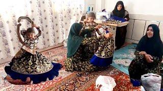 Sewing girls' dresses for weddings :Nomad and village life in IRAN