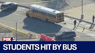 Girl in critical condition, boy hospitalized after being hit by school bus at suburban high school