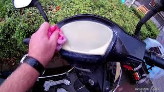 Polishing a sun damaged motorbike / scooter dash or speedometer.