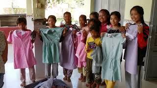 (4K) Matching the children to the correct sizes of clothing. Cambodia 2022.