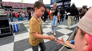 Brexton Busch signing autographs in Victory Lane