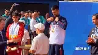 Novak Djokovic receives his Olympic Gold Medal