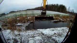 Removing beaver dams with a Long Reach Excavator