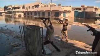 Libya fighters continue battle against pro-Gaddafi resistance