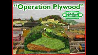 Buckland Junction 293 "Operation Plywood" Painting scenery to hide model railway layout framework.