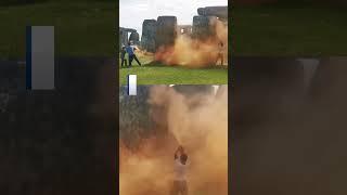 Stonehenge sprayed orange by climate activists