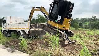 Lowering a Backhoe from a Truck