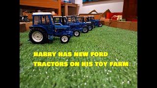 HARRYS GOT NEW FORD TRACTORS ON HIS TOY FARM