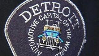 2 Detroit police officers charged with taking bribes in towing contract scandal