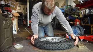 Fitting a motorcycle tyre and tube at Performance Classics.