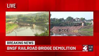 KTIV's two angles of the controlled blast at the collapsed Big Sioux River rail bridge