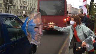 Protesting Pensioners In Minsk Fend Off Pepper Spray With Umbrellas