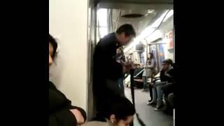 Crazy guy playing guitar in train
