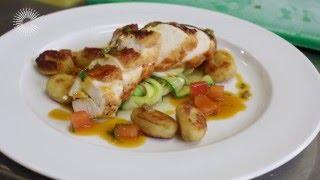 Breast of chicken with gnocchi, courgette ribbons and a tomato and olive sauce by Russell Brown