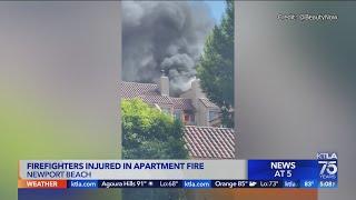 Firefighters injured in large apartment complex fire in Newport Beach