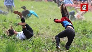 Competitors hospitalized as cheese-rolling contest spins out of control