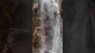 My daughter visiting a beautiful waterfall in Vietnam 