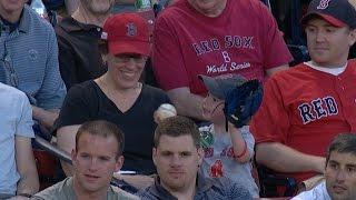 Teenage fan gives foul ball to young child